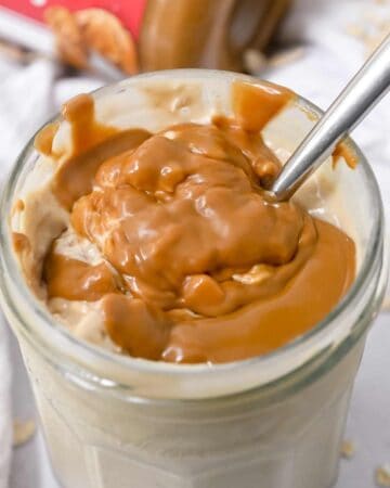 close up shot of overnight oats topped with Biscoff cookie butter.