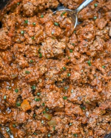 close up of cooked taco meat in a crock pot.